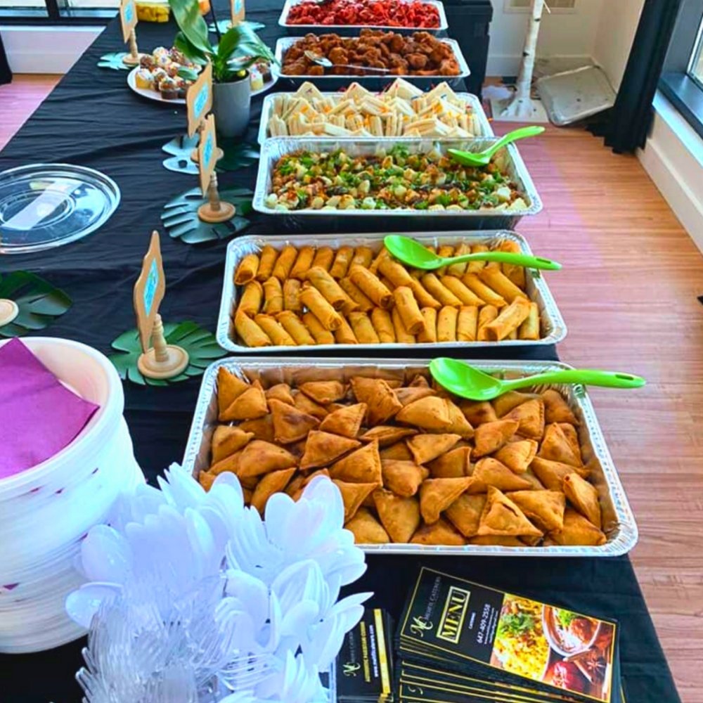 Close-up of biryani and grilled kababs